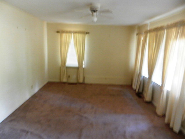 3283 Millerfield Road Macon, GA 31211 - Photo 5 of 15 an empty room with windows