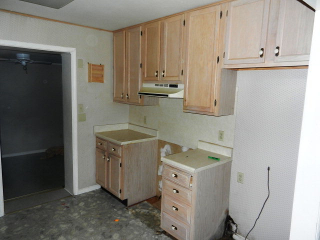 3283 Millerfield Road Macon, GA 31211 - Photo 7 of 15 a view of cabinets and utility room
