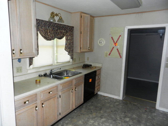 3283 Millerfield Road Macon, GA 31211 - Photo 8 of 15 a kitchen with a sink and a stove