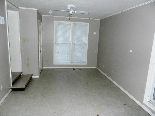 3283 Millerfield Road Macon, GA 31211 - Photo 9 of 15 an empty room with windows