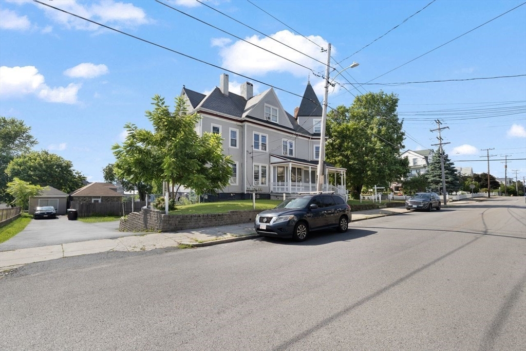 311 Elm Street Woonsocket, RI 02895 - Photo 27 of 29 a view of a car parked in front of a building