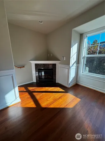 a room with pool table and windows