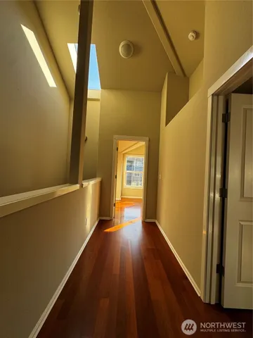 a hallway with wooden floor