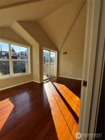 a view of swimming pool with wooden floor and seating space