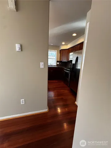 a view of a living room with wooden floor