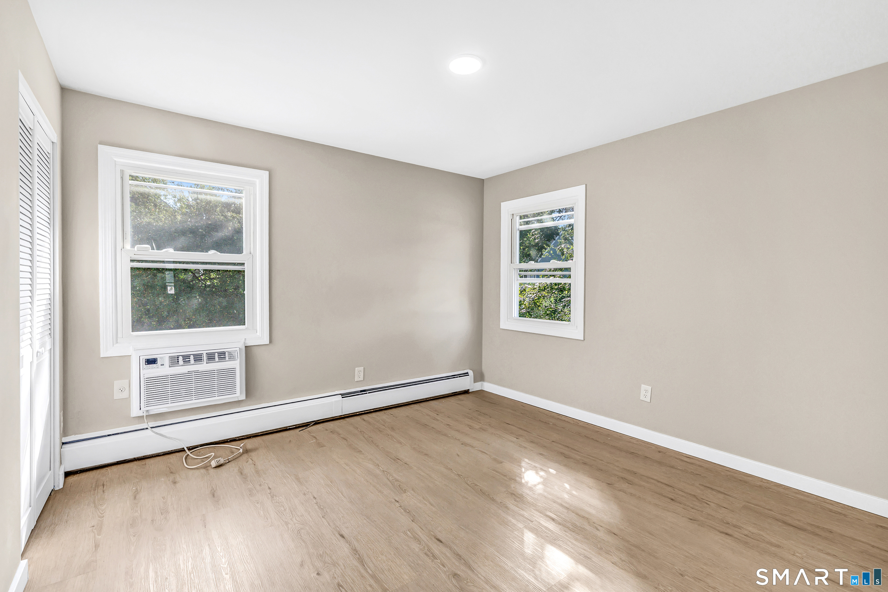 77 Meadow Lark Road Naugatuck, CT 06770 - Photo 19 of 40 Main Floor - Bedroom, vinyl flooring, wall unit for cooling, closets