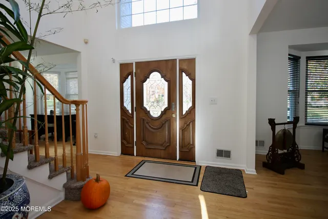 a living room with fireplace furniture and a flat screen tv