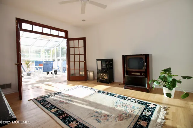 a view of a dining room with furniture and chandelier