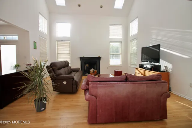 a kitchen with stainless steel appliances white cabinets and a window