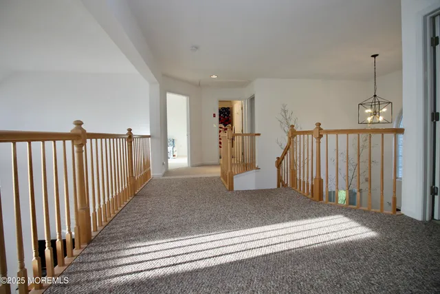 a bathroom with a bathtub sink and mirror