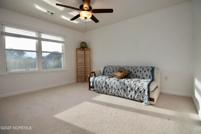a view of a roof deck with table and chairs a barbeque with wooden floor and fence