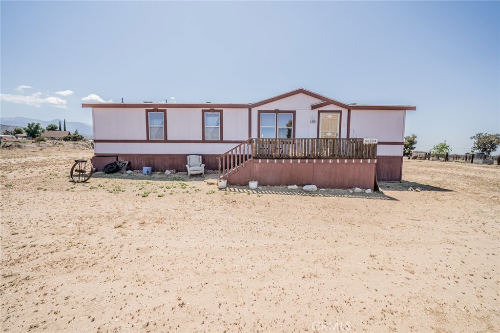 a house view with a wooden fence