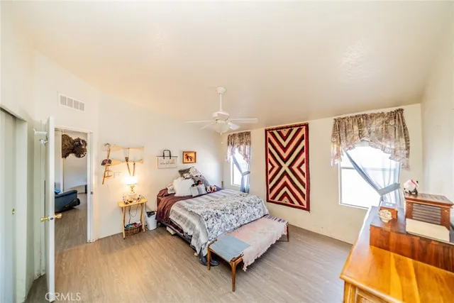 a bedroom with a bed and a couch