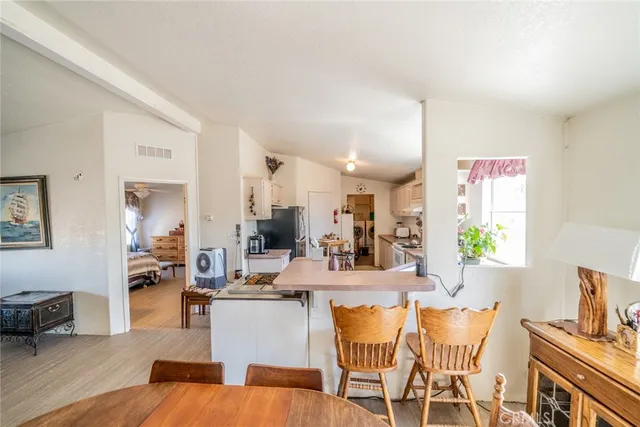 a living room with fireplace furniture and a wooden floor