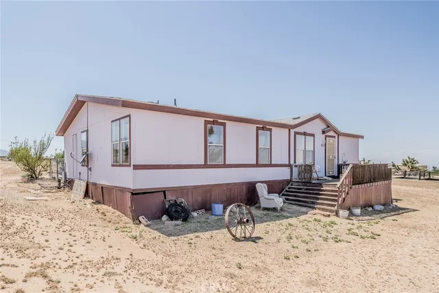 a front view of a house with a bench