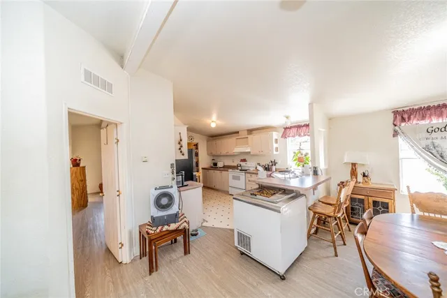 a view of a kitchen and dining room