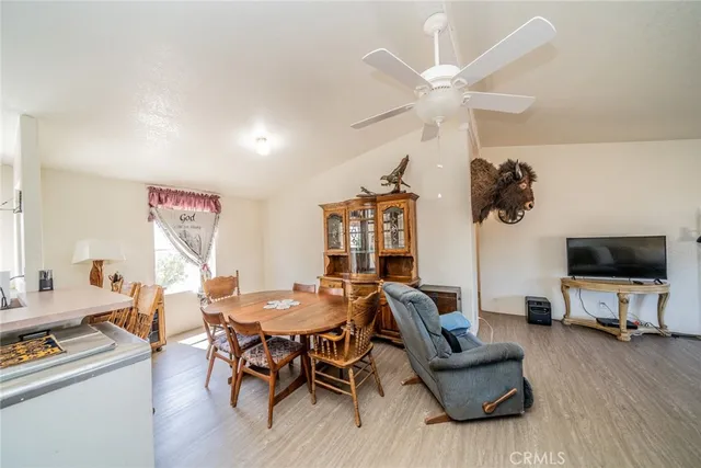 a view of a livingroom with furniture and a flat screen tv