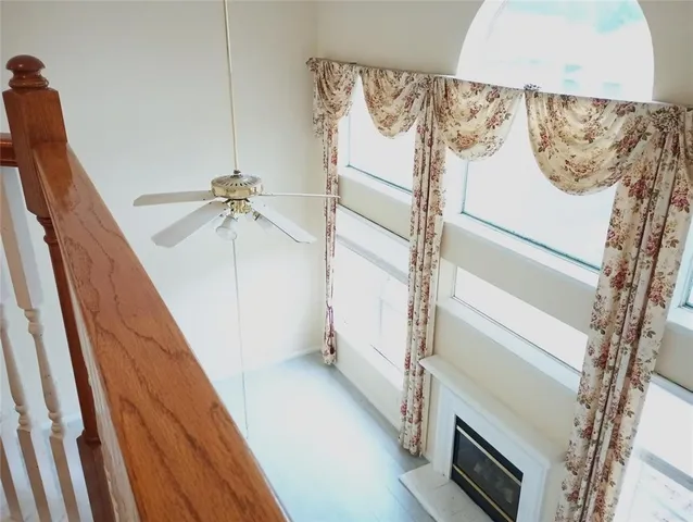 a view of a hallway with stairs