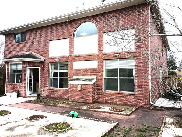 a front view of a house with large windows