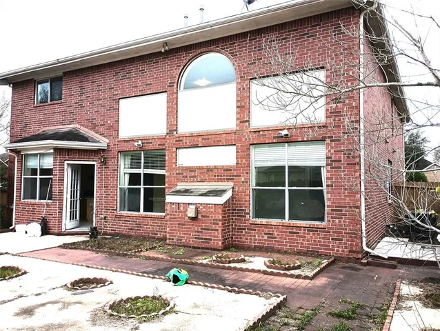 a front view of a house with large windows
