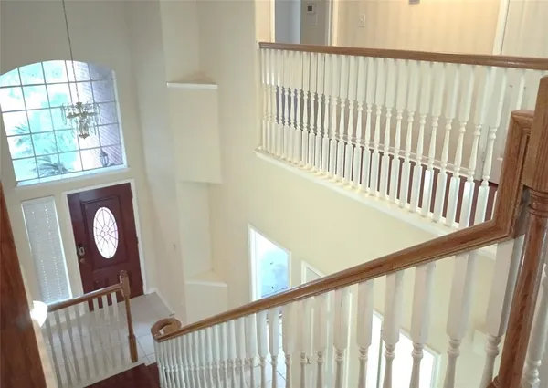 a view of staircase with open window