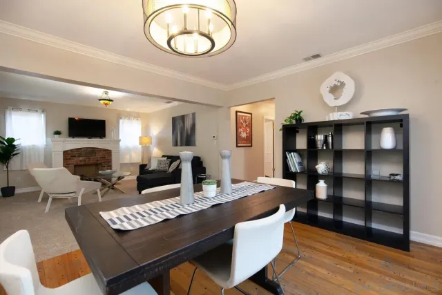 a living room with furniture a rug and a fireplace