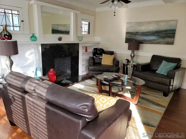 a living room with furniture and a fireplace
