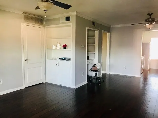 wooden floor in a hall with a window