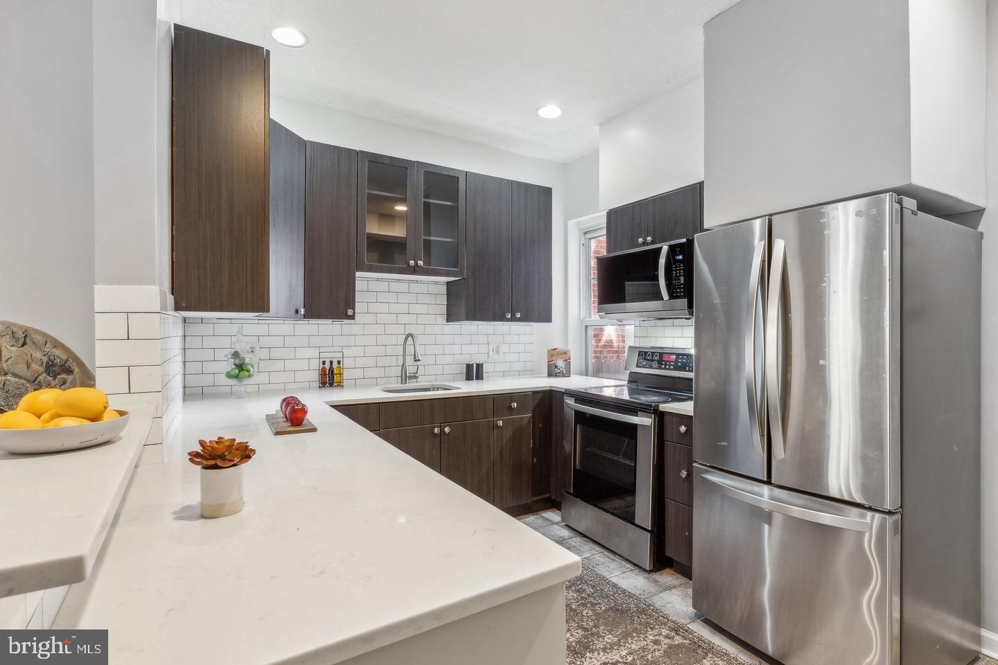 1267 Morse Street Northeast Washington, DC 20002 - Photo 1 of 14 Modern kitchen with sleek finishes.