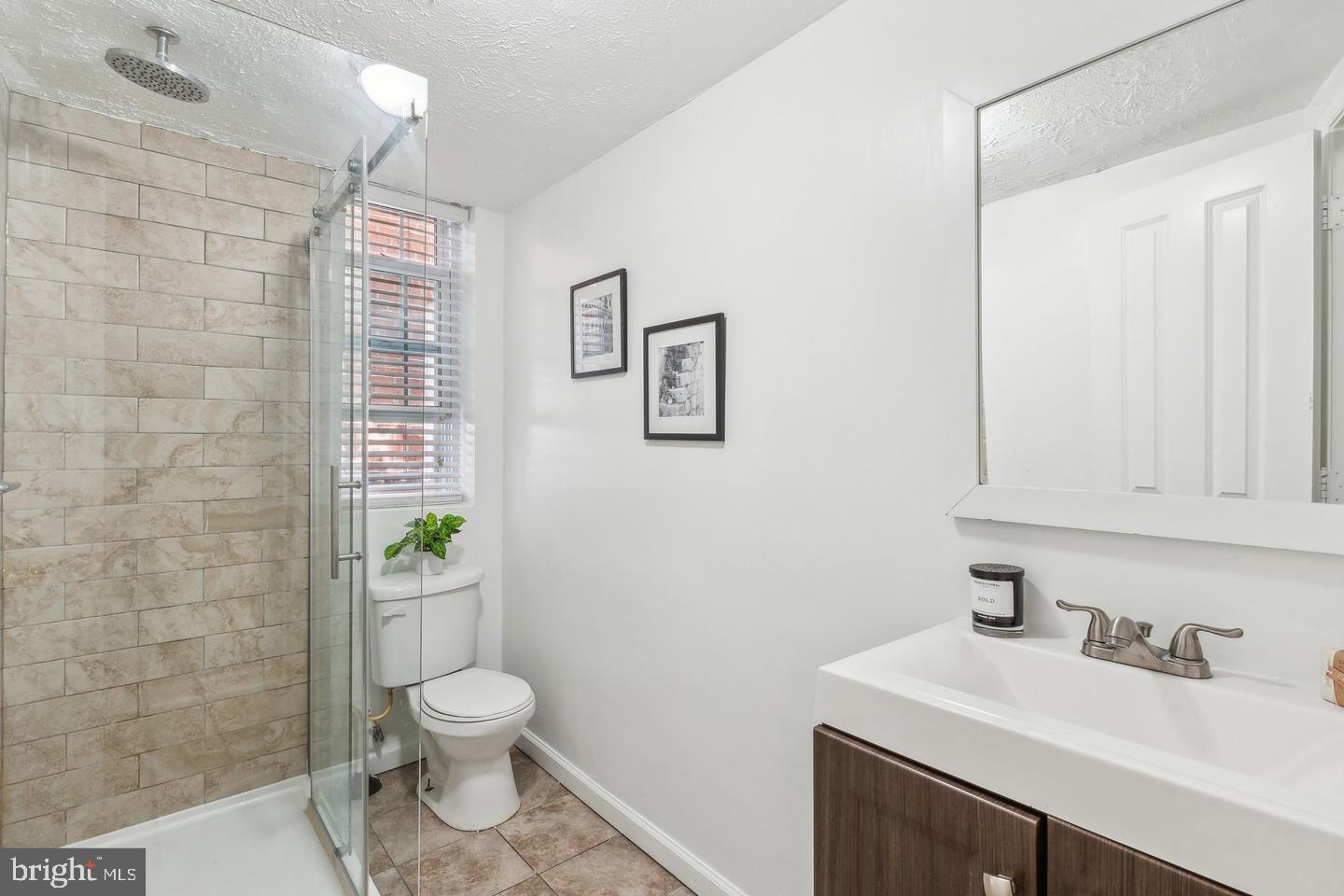 1267 Morse Street Northeast Washington, DC 20002 - Photo 9 of 14 Modern bathroom with sleek finishes.