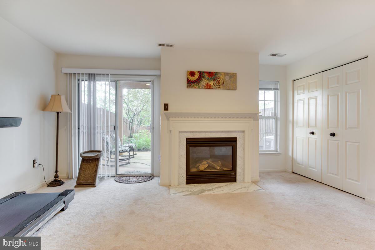 704 Howards Loop Annapolis, MD 21401 - Photo 6 of 44 Family Rm w/Gas FP & sliders to Deck & Fenced Yard