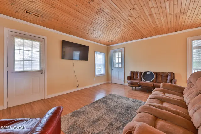 a kitchen with a table and chairs