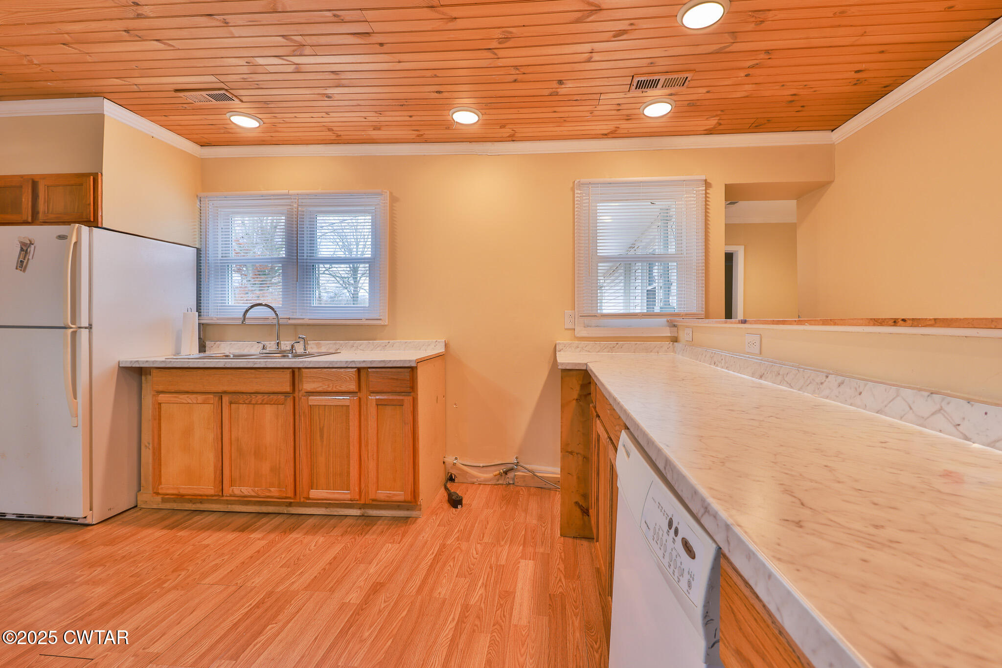 20 Seaboard Lane McKenzie, TN 38201 - Photo 21 of 29 a view of a kitchen with a sink and a refrigerator