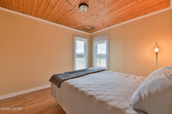 a room with furniture and wooden floor