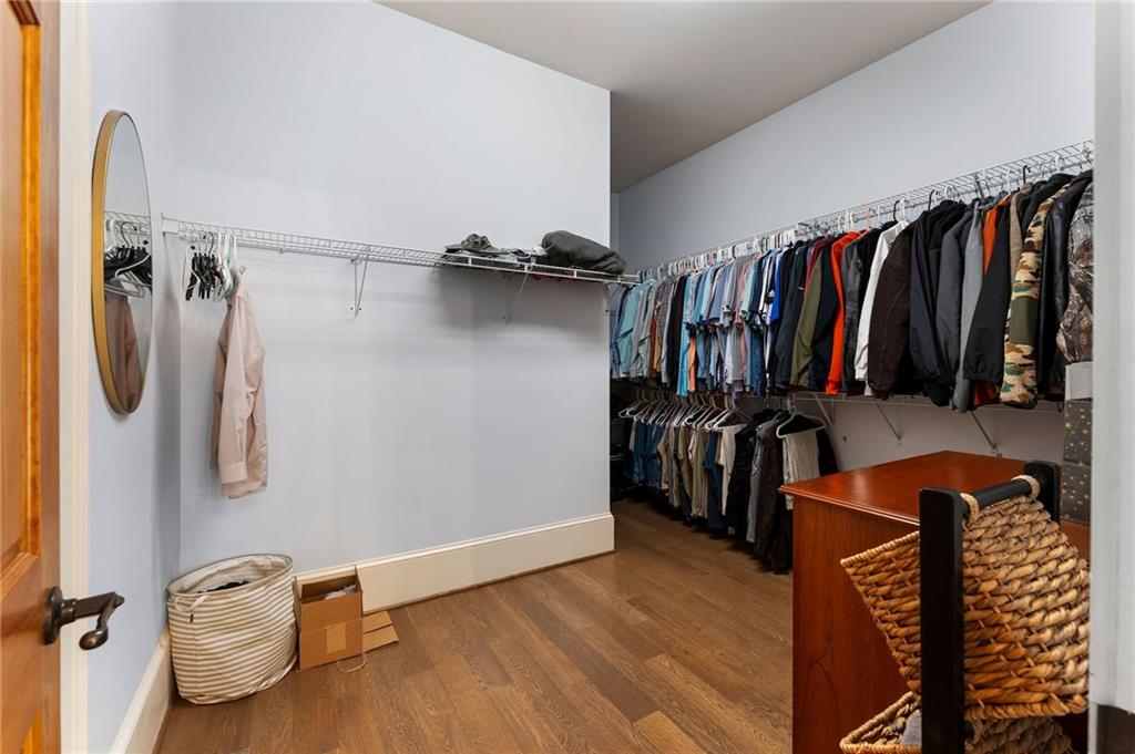 113 Vogel Street Calhoun, GA 30701 - Photo 40 of 65 a view of walk in closet with clothes and shoes