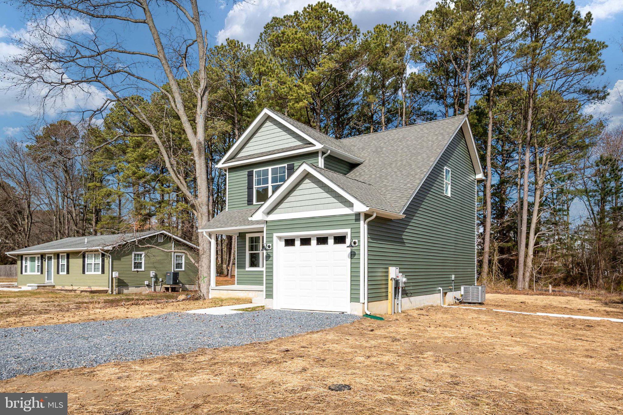 309 Talbot Road Stevensville, MD 21666 - Photo 3 of 26 Charming green home amid tall pines.