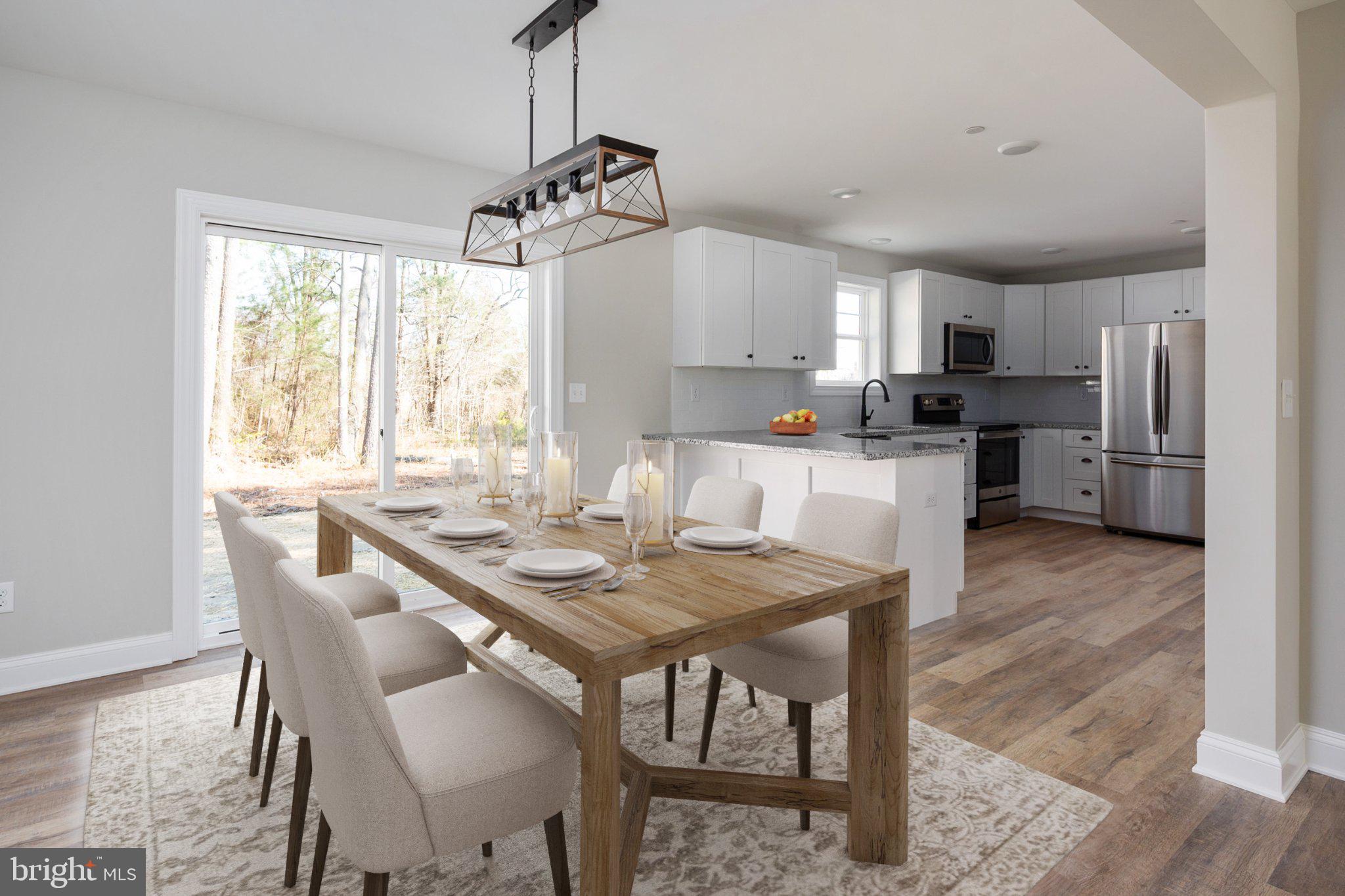 309 Talbot Road Stevensville, MD 21666 - Photo 8 of 26 Bright and inviting dining space.