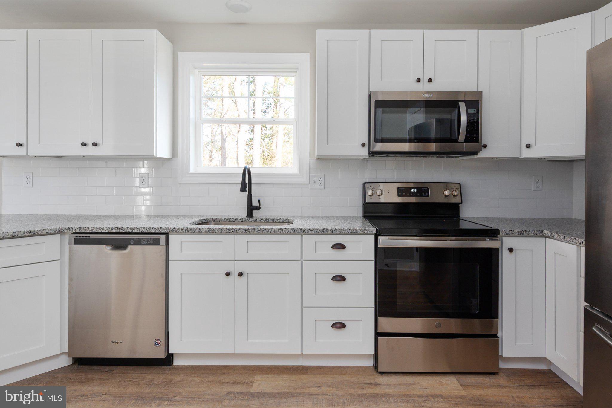 309 Talbot Road Stevensville, MD 21666 - Photo 10 of 26 Modern kitchen with sleek finishes.