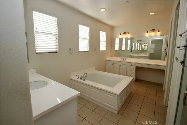 a view of a sink and a window in a bathroom
