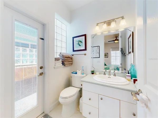 a bathroom with a double vanity sink mirror and toilet