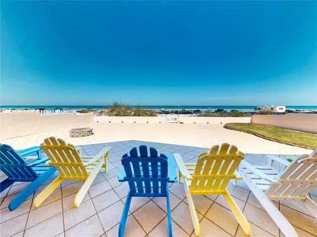 a view of a swimming pool with a lounge chair