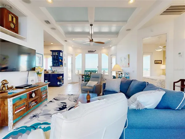 a living room with furniture fireplace and a window