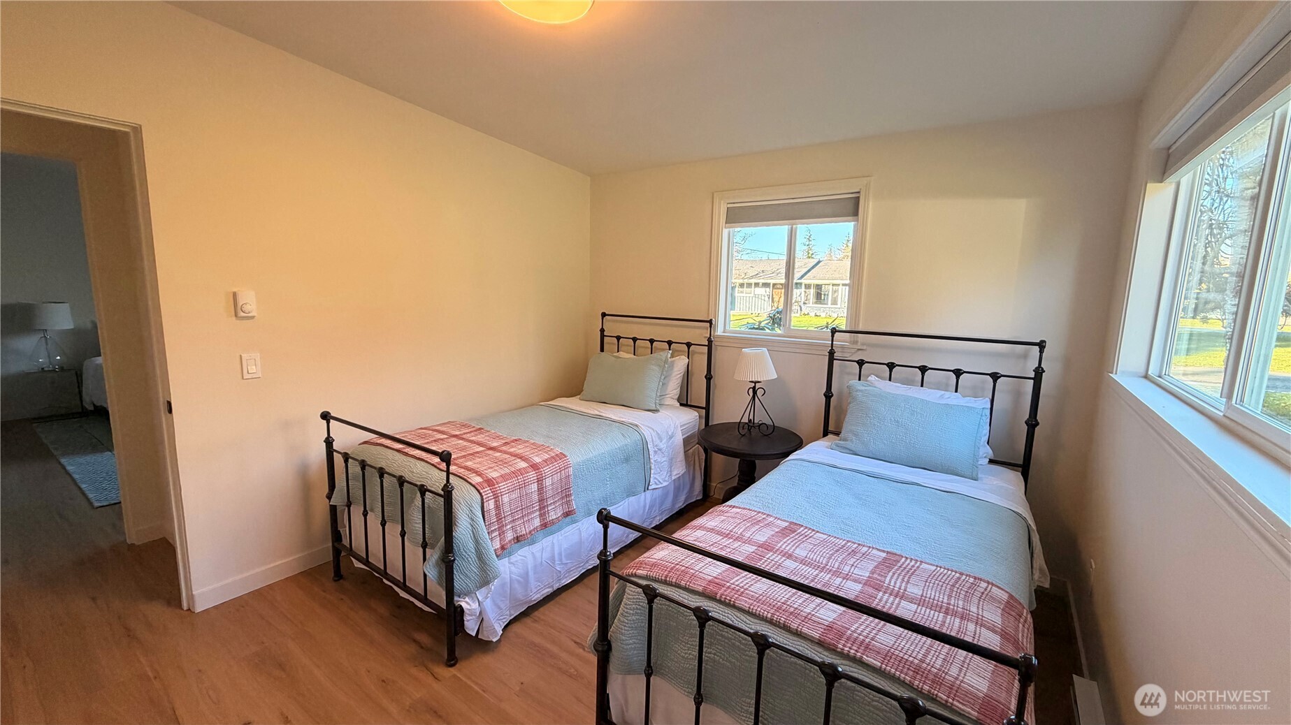 630 7th Avenue Forks, WA 98331 - Photo 21 of 39 a bedroom with two beds and wooden floor
