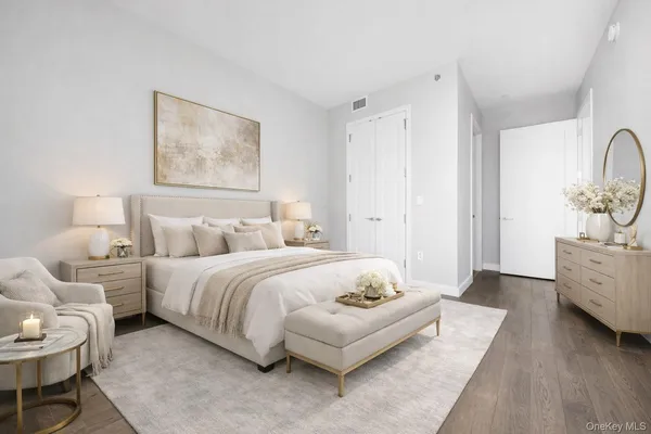 a spacious bedroom with a bed and a couch