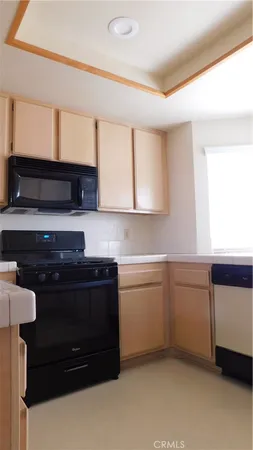a kitchen with a sink and a stove