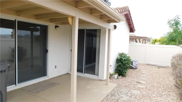 a view of a house with a potted plant