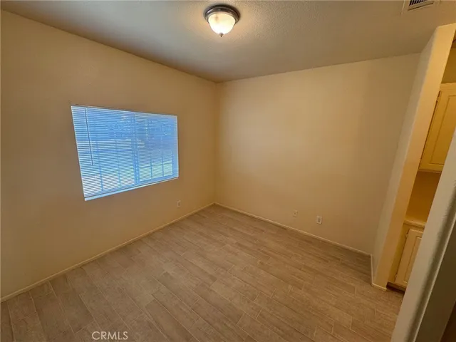 an empty room with a wooden door