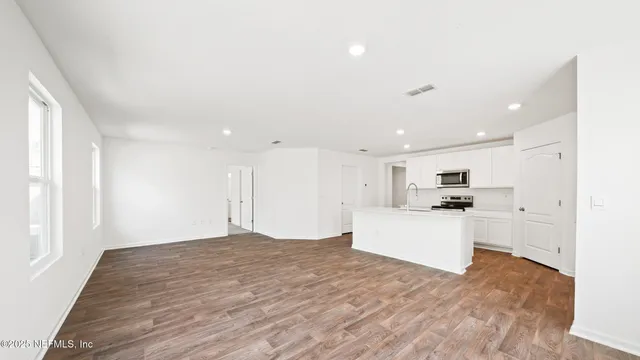 a view of swimming pool with a garden and lake view