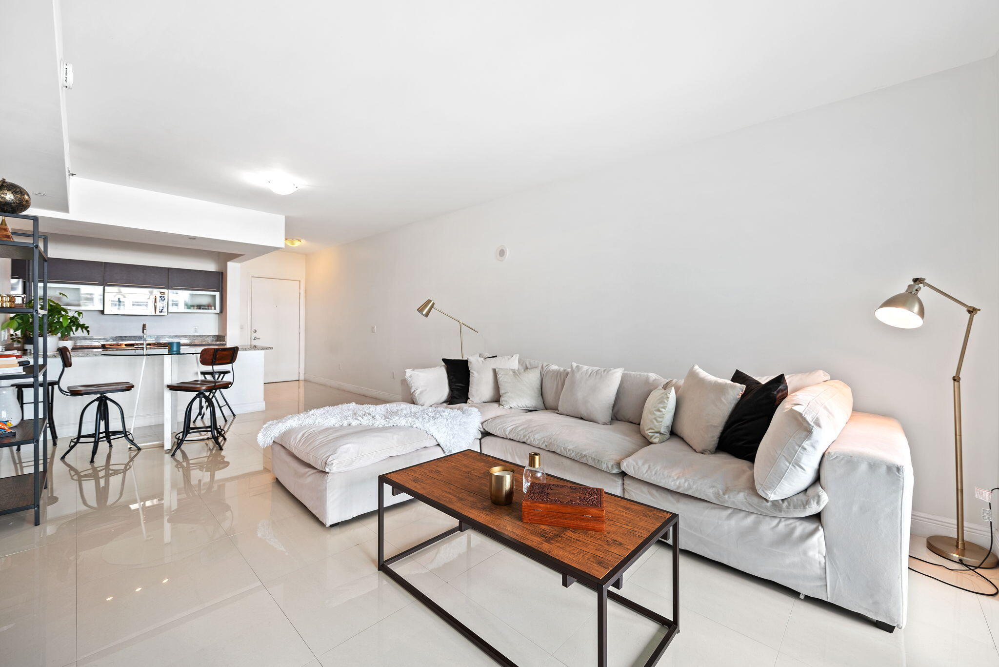 951 Brickell Avenue, Unit 400 Miami, FL 33131 - Photo 16 of 40 a living room with furniture and a table