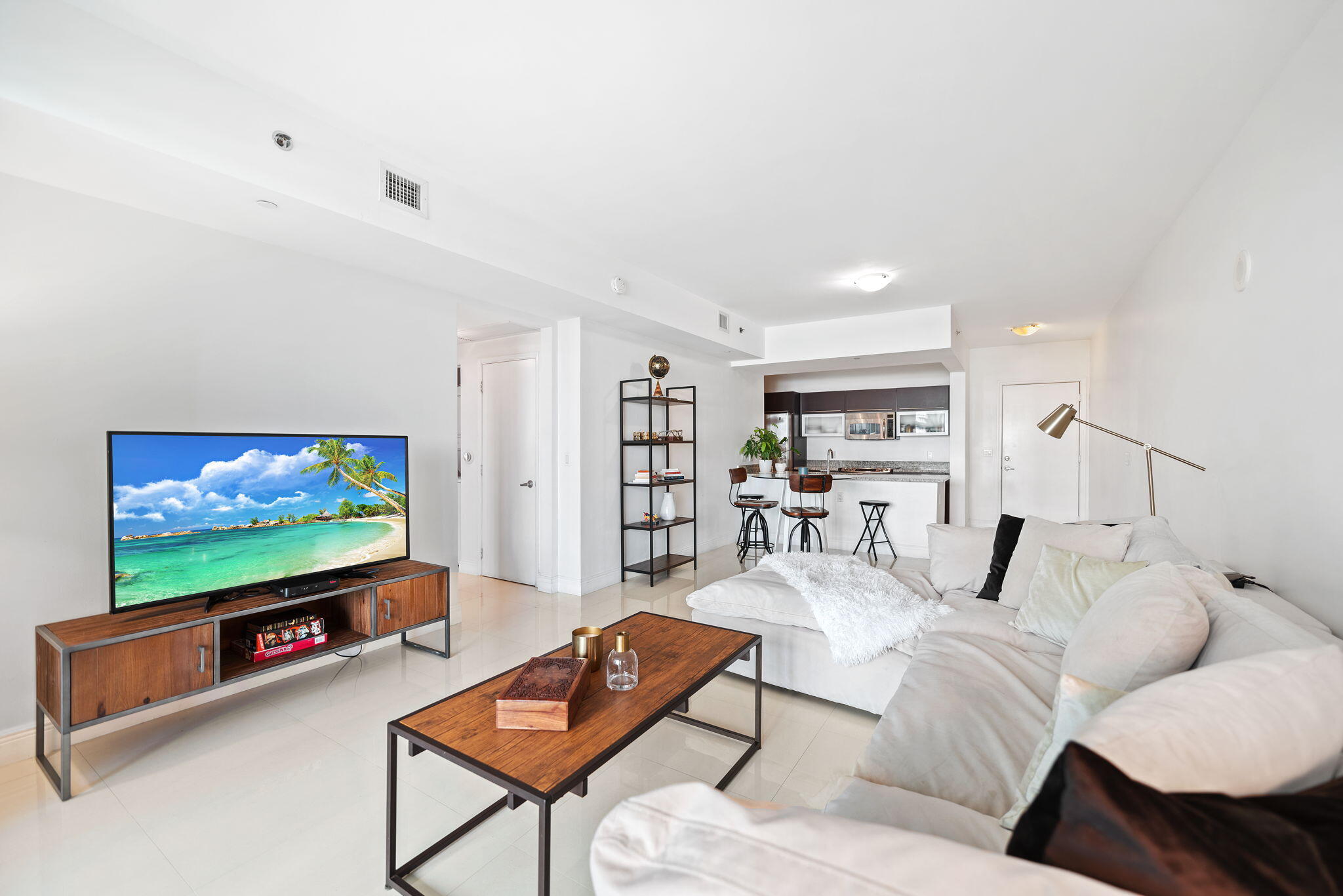 951 Brickell Avenue, Unit 400 Miami, FL 33131 - Photo 17 of 40 a living room with furniture and a flat screen tv